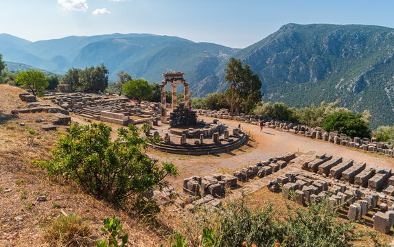 Delphi, Greece - June 28, 2023: View of museum with ancient ruins of the Temple of Athena Pronaia. Ancient Delphi.