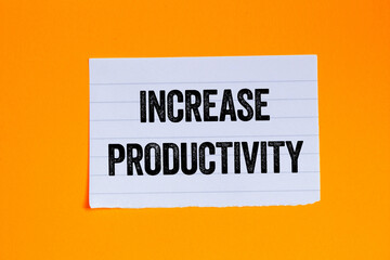 Increase productivity message written on ripped torn white paper piece on orange background. Conceptual increase productivity symbol. Copy space.