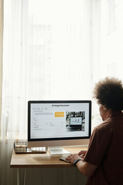 Unrecognizable Man With Curly Hair Working On Artificial Intelligence System
