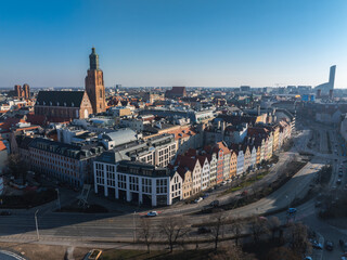Aerial view of Wroclaw, Poland, showcasing St. Elizabeth's Church, colorful gabled townhouses, a...