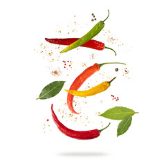 Color hot dried chilli peppers isolated on white background. Flying red, orange, green and yellow...