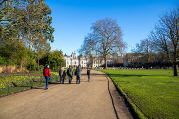 Fototapeta premium A long winding footpath in a beautiful landscape at St James's Park with lush green trees in Westminster in Central London England UK