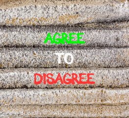 Agree to disagree symbol. Concept words Agree to disagree on beautiful grey stone wall. Beautiful...