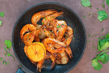 Marinated shrimp in a spicy grill with lime and garlic. Delicious fresh seafood, Mediterranean cuisine.