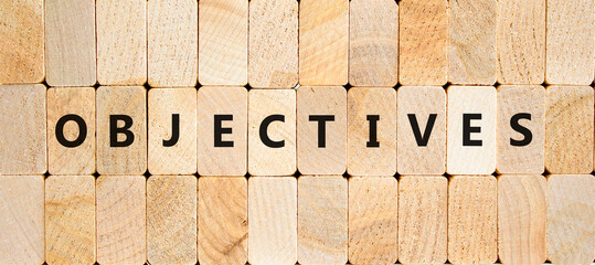Objectives symbol. Concept word Objectives on beautiful wooden blocks. Beautiful wooden blocks...