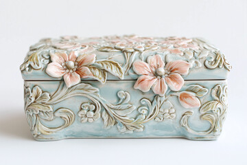 Handmade ceramic jewelry box with intricate glazed details, soft pastel tones, white background
