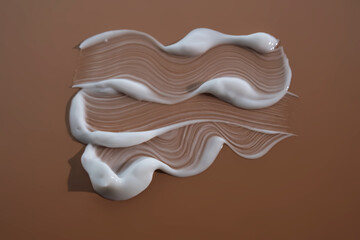 White moisturizer on beige background.