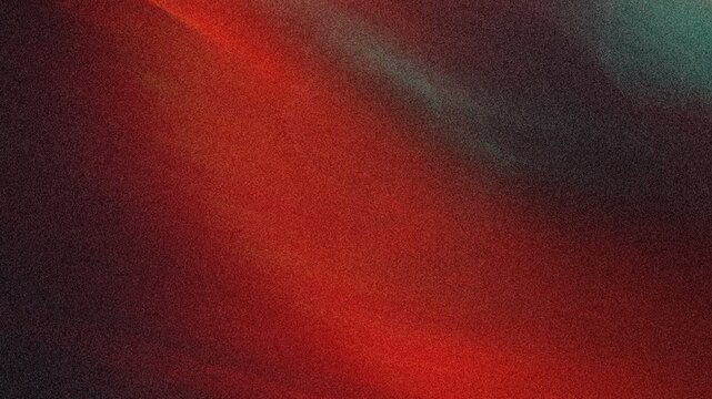Abstract background featuring a gradient of red and dark colors creating a soft and blurred effect