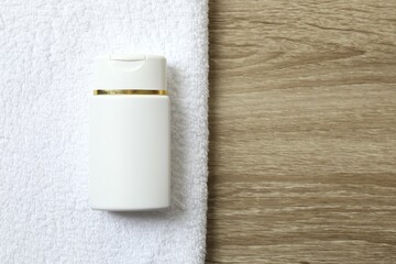 White towel and cosmetic bottle on the table