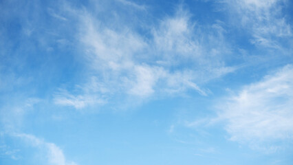 The sky is a vibrant, cloudless blue, while the sun shines brightly, making it appear even more radiant.