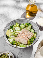 green salad with chicken, cucumber and broccoli