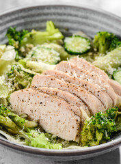 green salad with chicken, cucumber and broccoli