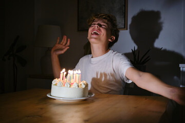 Joyful teenage birthday celebration with candlelit cake