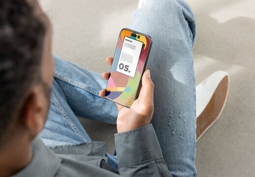 Smartphone Screen Held by Seated Person. PSD mockup