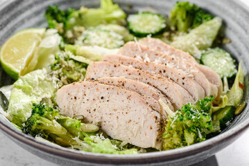green salad with chicken, cucumber and broccoli