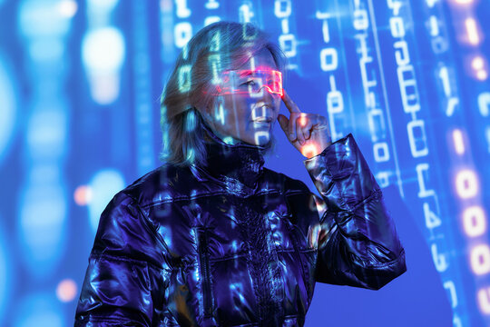 Elderly asian woman exploring virtual worlds in metaverse