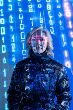 Elderly asian woman exploring virtual reality realm