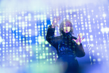 Elderly asian woman explores the virtual metaverse world