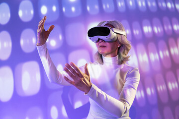 Elderly asian woman exploring the metaverse in virtual reality