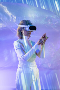 Elderly asian woman exploring virtual reality world