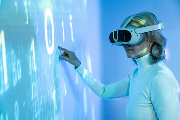 Elderly asian woman exploring technology with VR headset