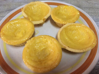 lemon meringue pie, egg tarts on vintage plate on the table