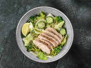 green salad with chicken, cucumber and broccoli