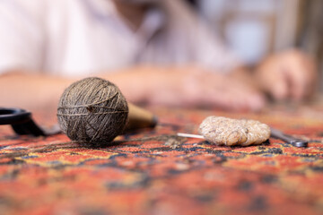 Iranian rug specialist in Salzburg workshop focuses on restoration