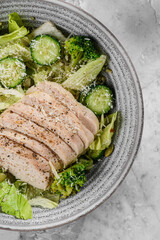 green salad with chicken, cucumber and broccoli