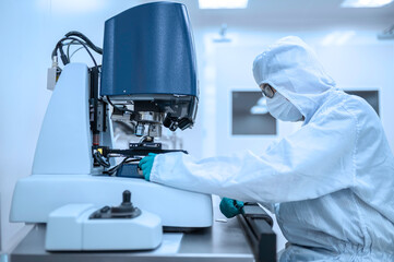 Scientist in laboratory,research experiment using microscope,lab work and sample analysis,scientific research process.