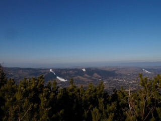 Expansive Mountain Landscape View from Summit with Distant Plains and Winding River Under Clear...