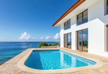 Fototapeta premium Modern residence offers a sparkling pool beside expansive ocean vistas under a clear sky.