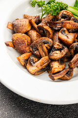 Mushrooms fried champignons vegetables dish fresh gourmet food background on the table rustic food top view copy space food