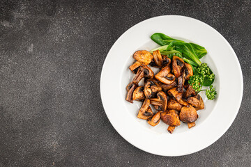 Mushrooms fried champignons vegetables dish fresh gourmet food background on the table rustic food top view copy space food