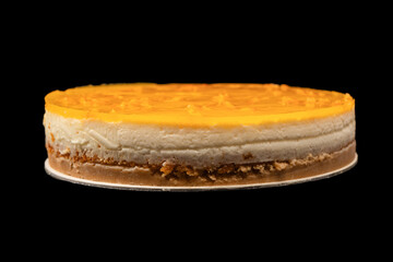 Orange cheesecake isolated on a white background.