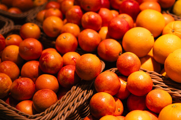 Pile of ripe sicilian oranges at market as background.