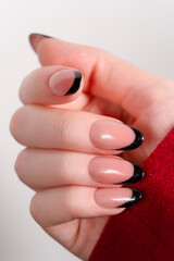 A contrasting black-and-white French manicure with shimmering details, adding a touch of elegance...