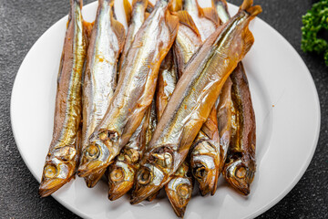 smoked capelin fish sprat vegetables dish fresh gourmet food background on table rustic food top view copy space 