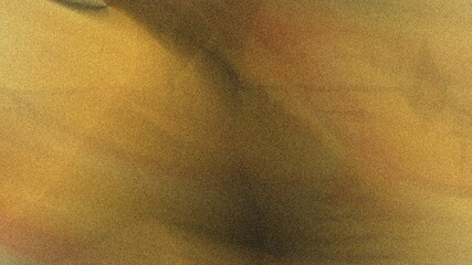 Abstract blurred background featuring shades of yellow brown and black creating a soft and dreamy effect