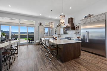 A modern kitchen featuring stainless steel appliances and a spacious island