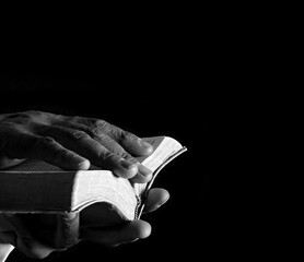 praying to God with hands on light dark background with people stock image stock photo	