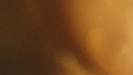 Abstract blurred background featuring gradients of brown and gold creating a soft light effect