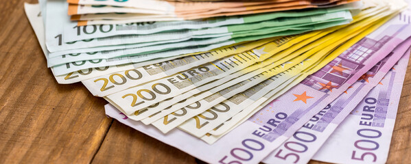close up of pile of paper euro banknote, finance background
