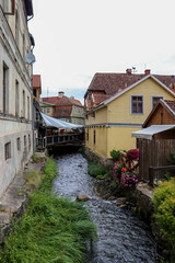 Old town Kuldiga in Latvia. River between houses.