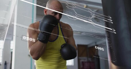 Bald man in yellow tank top boxing with digital data overlay animation - Powered by Adobe