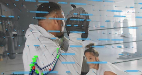 Boxing training session with data analysis animation overlaying athletes in gym - Powered by Adobe