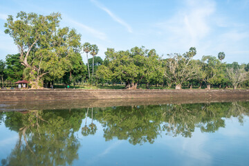 Angkor Wat, A remarkably tall building set against a clear blue sky backdrop