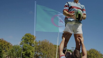 Holding rugby ball, player with Algerian flag waving in background, animation - Powered by Adobe