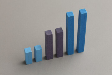 Colorful bar graph with arrow pointing upwards. Business, market growth and progress concept.