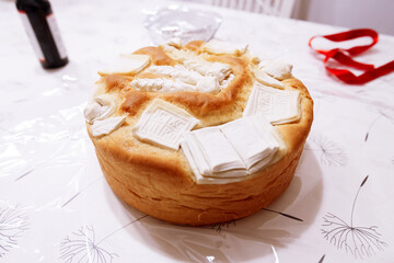 Handcrafted Festive Bread With Intricate Dough Decorations And Cultural Symbolism